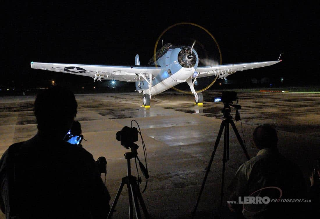 Airplane being photographed at night